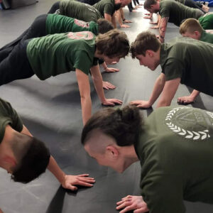 ISD - Teens class, teenagers doing push ups in a gym