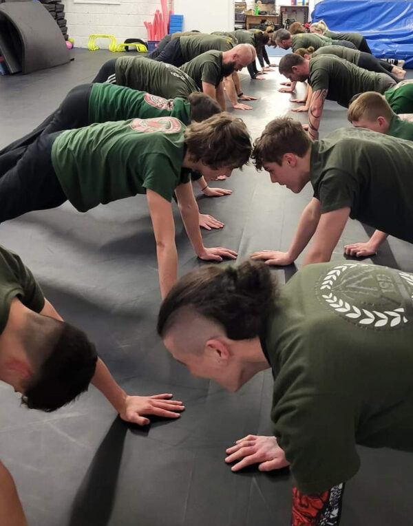 ISD - Teens class, teenagers doing push ups in a gym